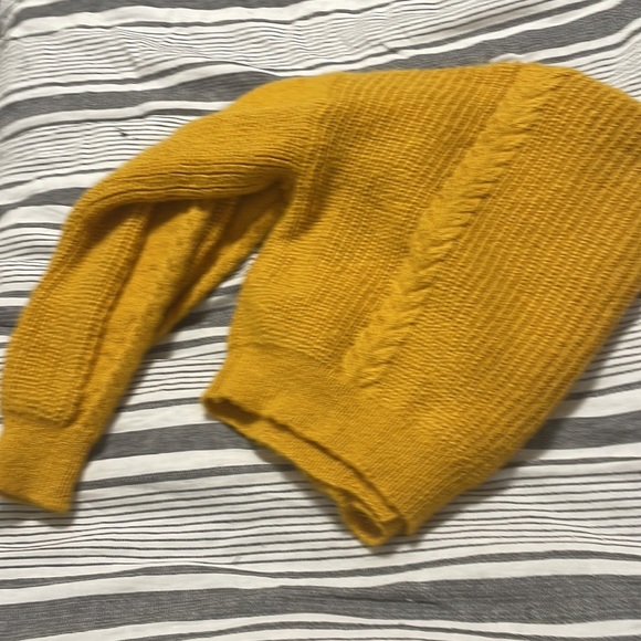 The color of the cardigan is yellow with buttons down the middle. - Picture 3 of 7